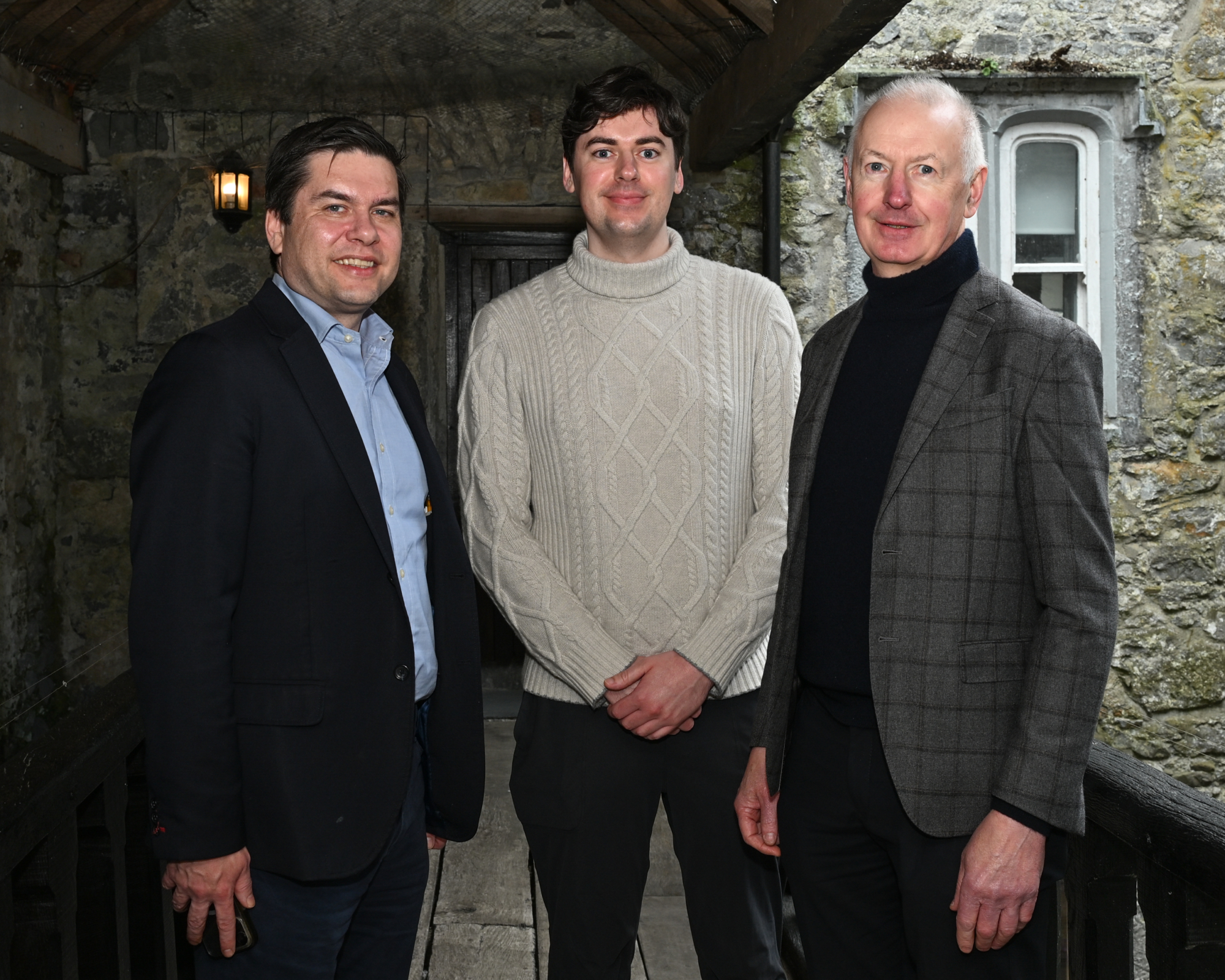 Councillor Andrew McGuinness with Evan and Dylan Brennan, grandson and son of Jim Brennan who had a butcher's shop in Rothe House until 1980.