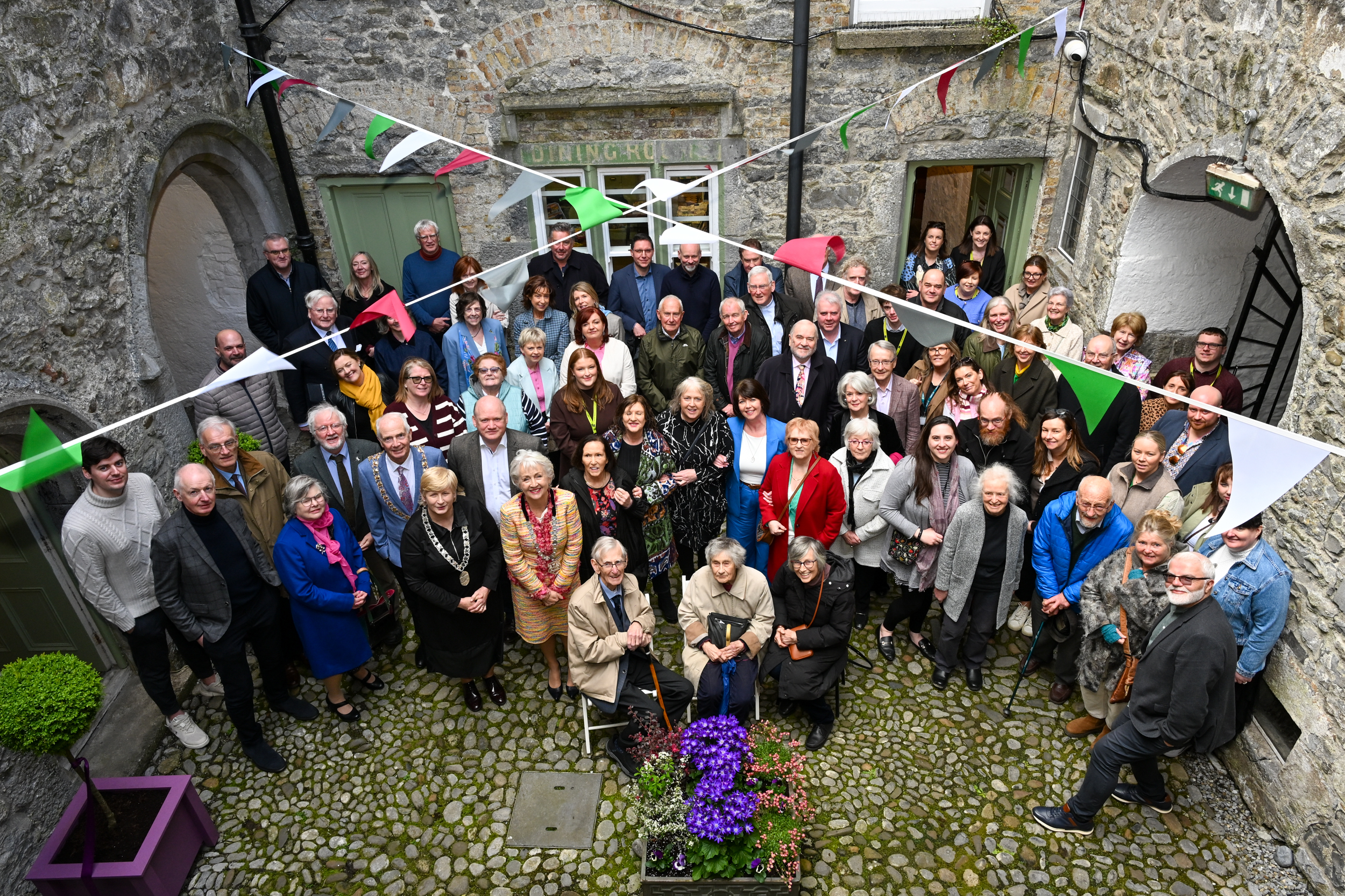 A crowd gathered in the first courtyard of Rothe House.