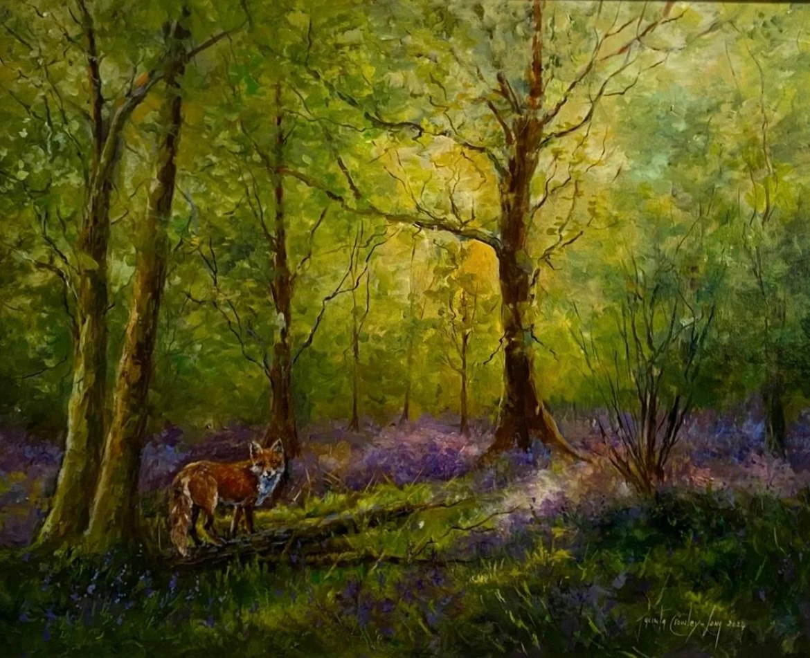 A painting of a fox in a wood with the evening sun breaking through the native trees, by artist Jacinta Crowley-Long