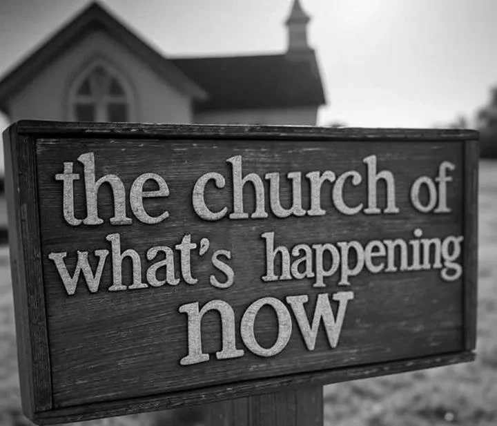 'The church of what's happening now' sign